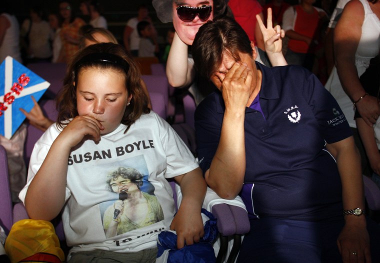 Fans of television show 'Britains Got Talent' singer Susan Boyle react in their local community centre in Blackburn, Scotland after it was announced that Boyle came second in the competition